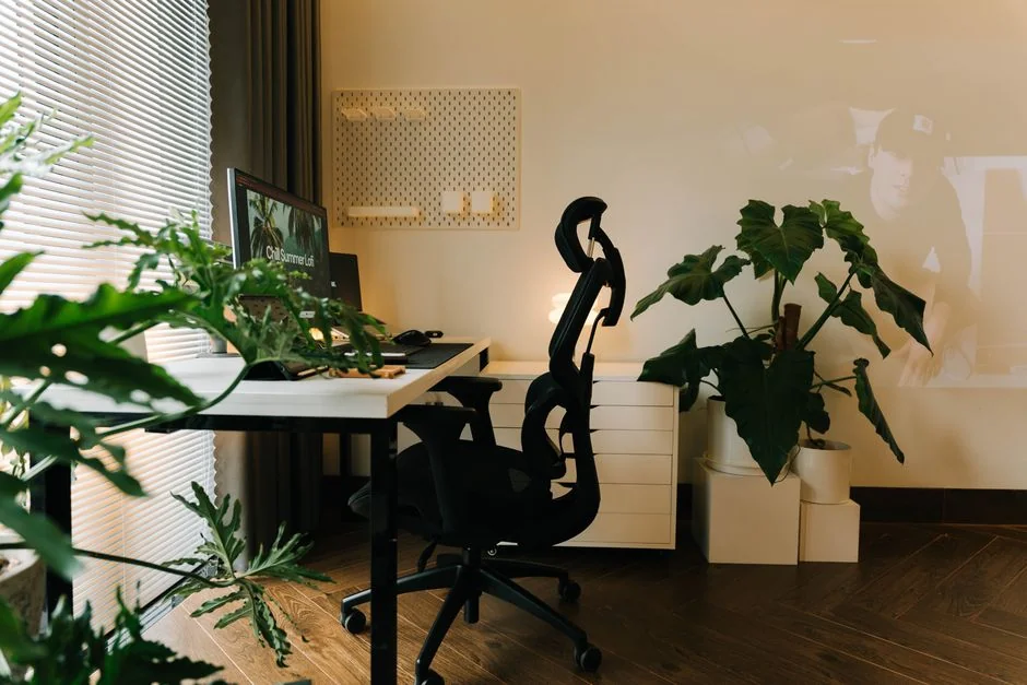 High-angle view of a stylish work desk featuring dual monitors, keyboard, mouse, and modern accessories.